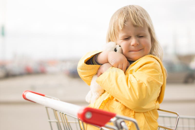 Adorable baby sit in supermarket cart