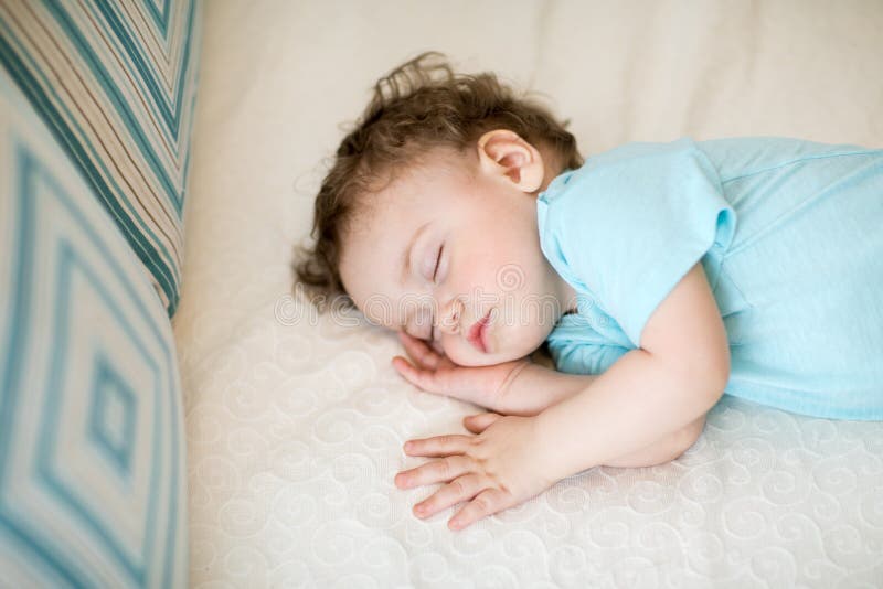 Adorable baby sleeping and having sweet dreams royalty free stock image Adorable baby sleeping and having sweet dreams royalty free stock image