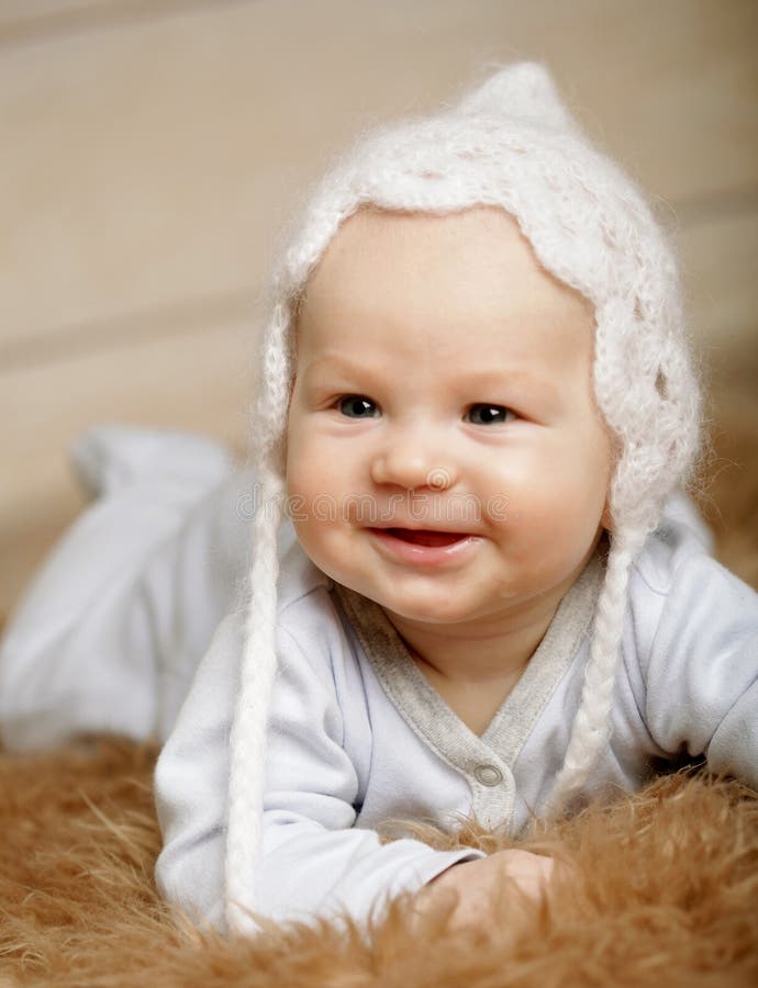 Baby Newborn Sleeping in Woolen Hat on White Wood Stock Photo Image