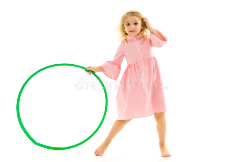 Adorable Blonde Girl Playing or Exercising with Hula Hoop, Cute Barefoot Girl Wearing Pink Cotton Dress Looking at Camea, Full Length Portrait of Lovely Kid Isolated on White Background