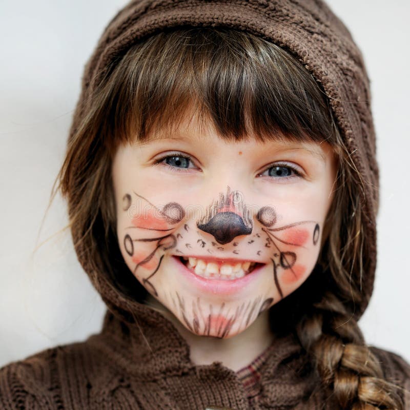 Adorable child girl with painted face