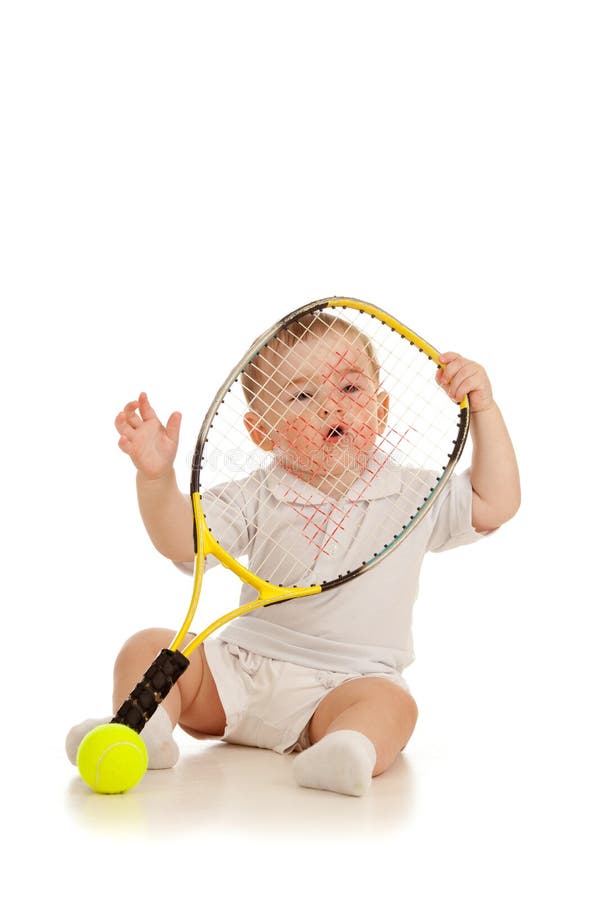 Adorable child playing with tennis racket and ball over white background. Adorable child playing with tennis racket and ball over white background