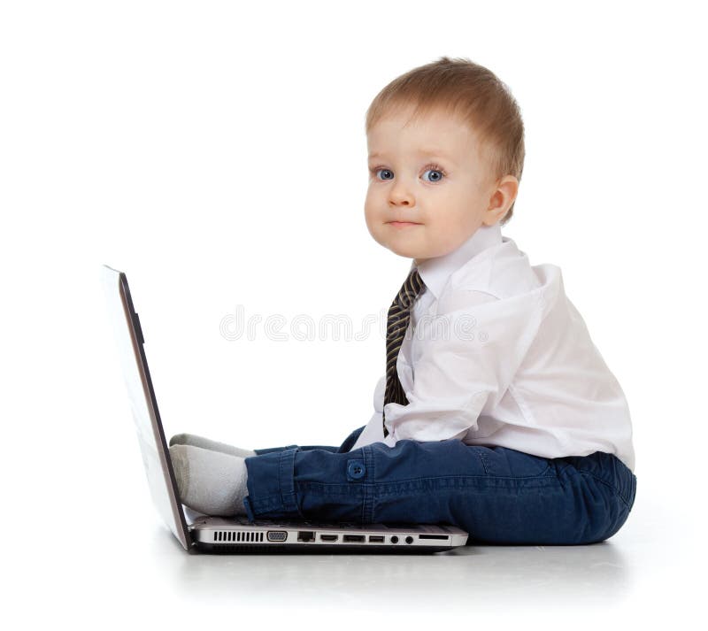 Adorable child using a laptop stock image