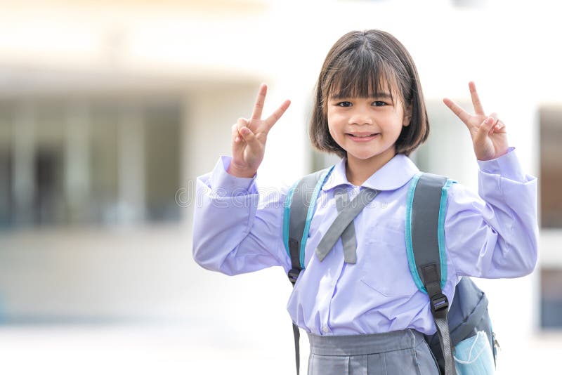 Adorable Cute Child Schoolgirl Posing with Peace Signs Stock Photo ...