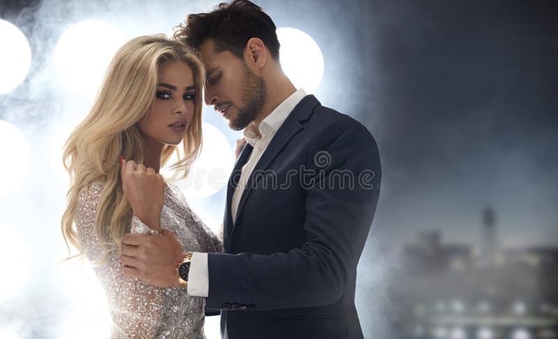 Adorable, elegant lady seducing her handsome boyfriend royalty free stock images Adorable, elegant lady seducing her handsome boyfriend royalty free stock images
