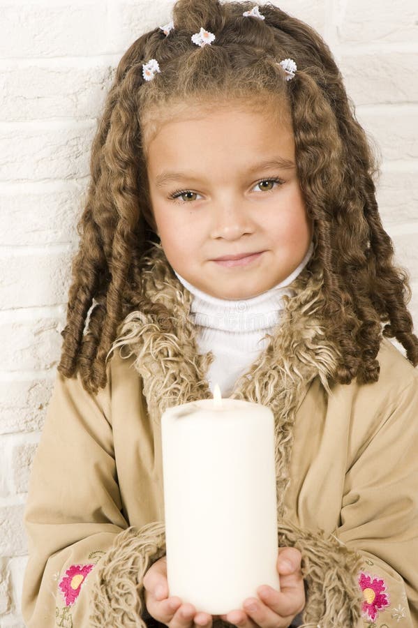 Adorable girl with candle stock photo. Image of care 22114776