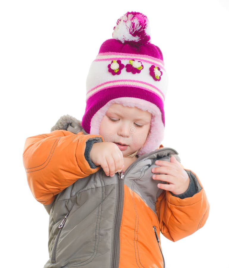 Adorable girl dressing winter jacket and hat