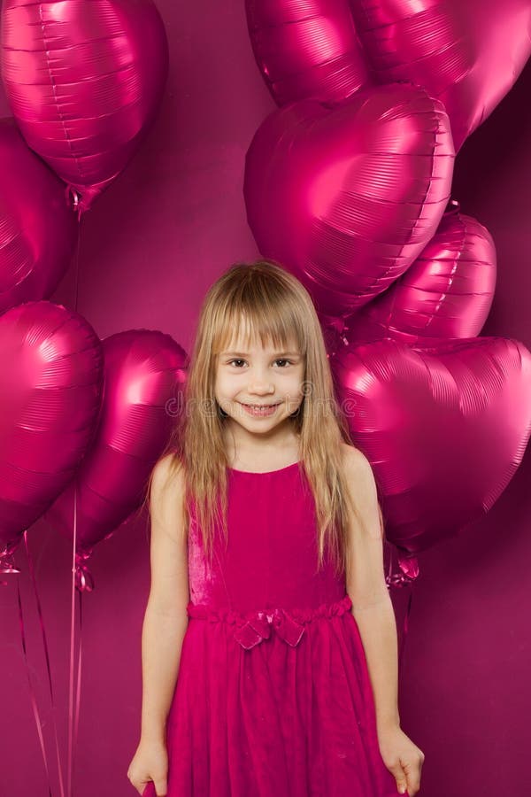 Adorable Girl With Pink Balloons On Vibant Pink Background Stock Image