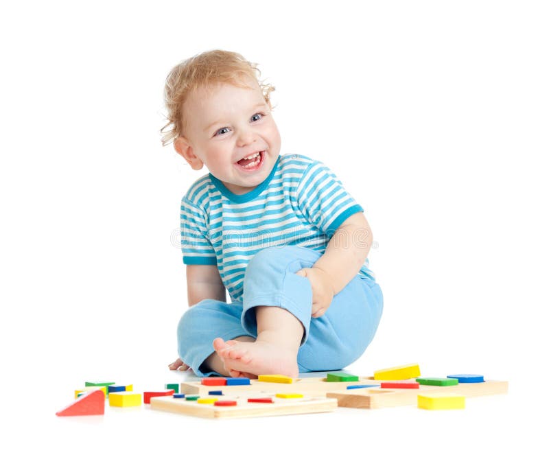 Adorable happy child playing educational toys