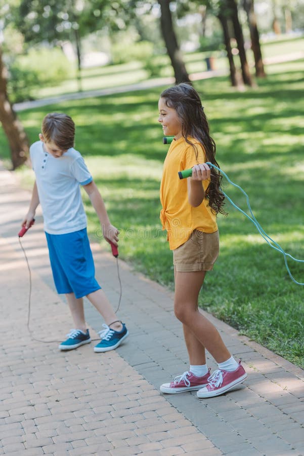 Adorable Happy Kids Playing with Jumping Ropes Stock Photo - Image of