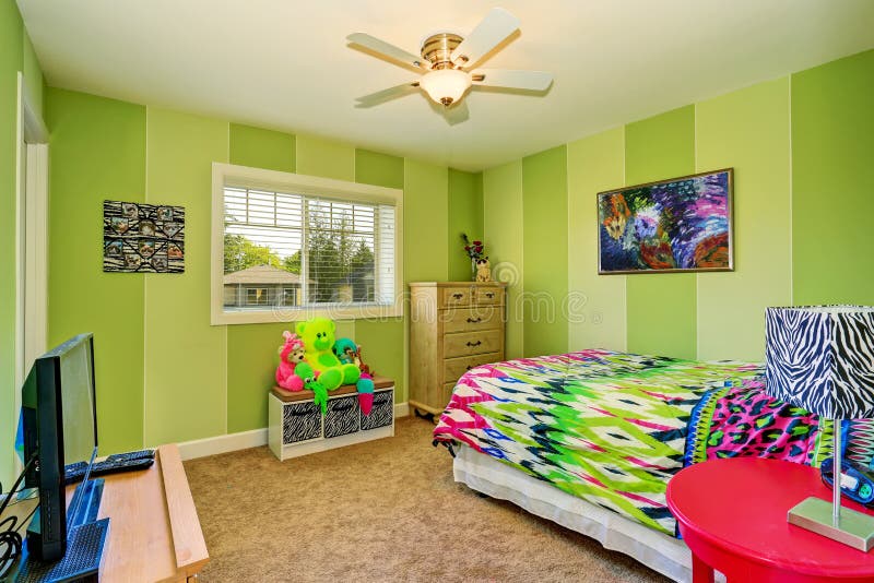 Adorable kids room in green color with bright colorful bedding stock images Adorable kids room in green color with bright colorful bedding stock images