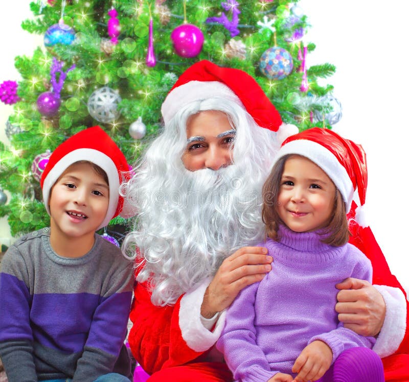 Adorable kids with Santa Claus royalty free stock photo Adorable kids with Santa Claus royalty free stock photo