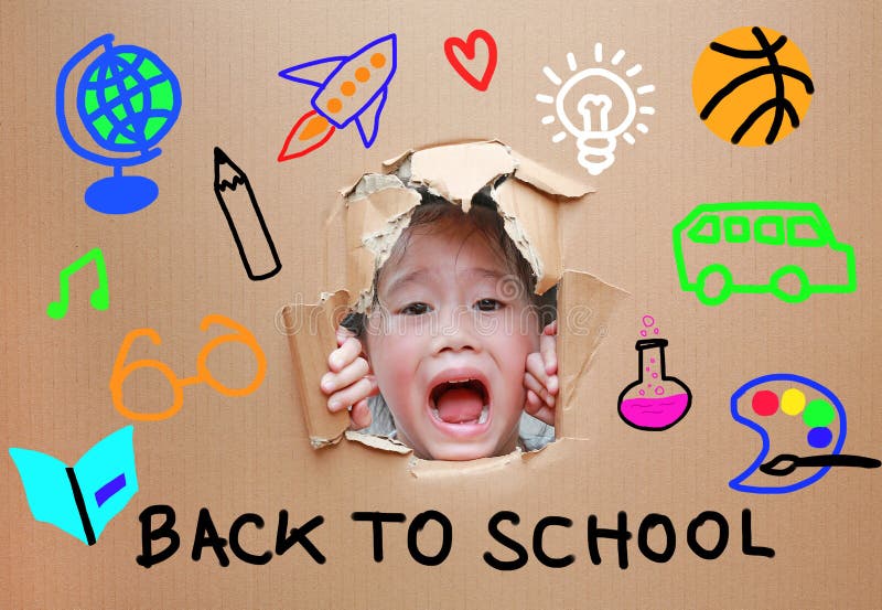 Adorable little Asian kid girl looking through hole on cardboard with Back to school and education concept stock photo Adorable little Asian kid girl looking through hole on cardboard with Back to school and education concept stock photo