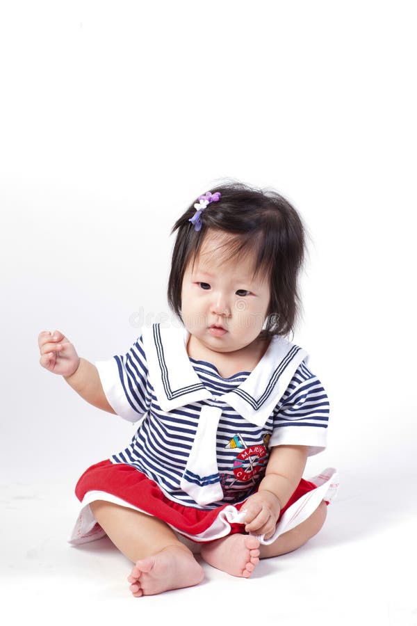 Adorable Little Baby Girl , Sitting & Playing in the Studio Stock Image ...