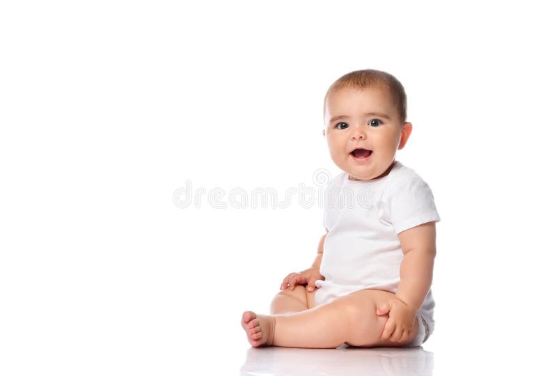 Adorable little baby smiling, sitting on the floor, studio shot, isolated on white background, lovely baby portrait. Adorable little baby girl smiling, sitting royalty free stock images Adorable little baby smiling, sitting on the floor, studio shot, isolated on white background, lovely baby portrait. Adorable little baby girl smiling, sitting royalty free stock images