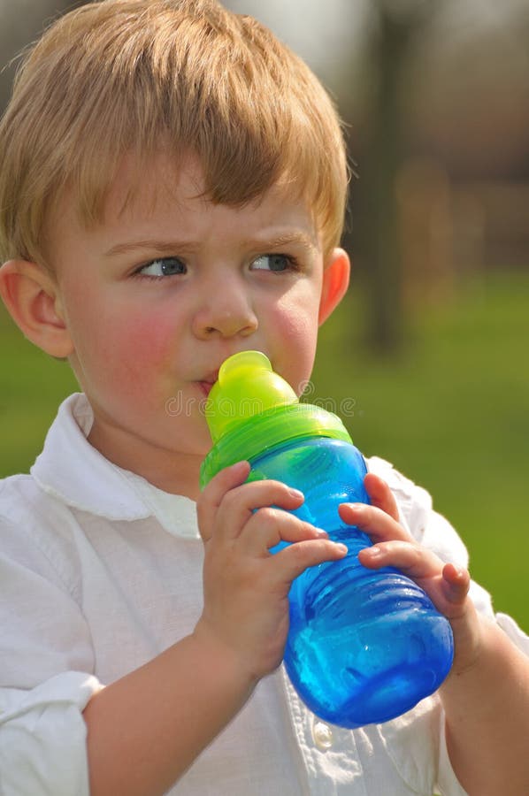 Adorable Little Boy Drinking Water Stock Photo - Image of face ...