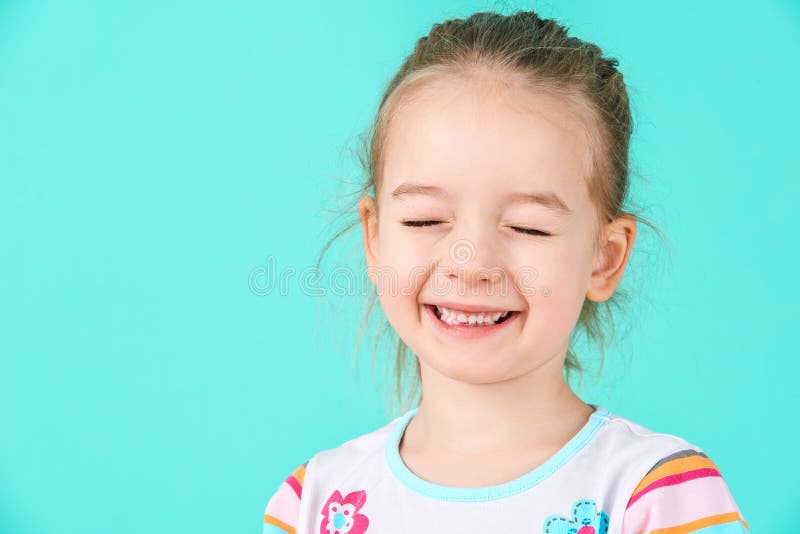 Adorable little girl with attitude. Cheeky preschooler headshot portrait.