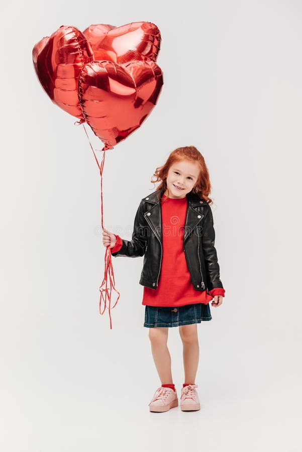 adorable little girl with balloons in shape of hearts royalty free stock photos adorable little girl with balloons in shape of hearts royalty free stock photos