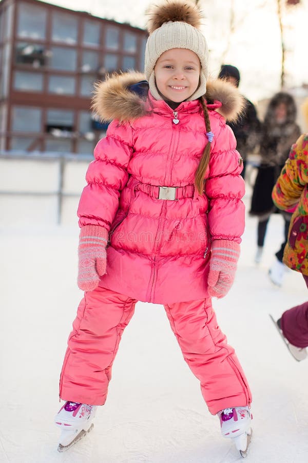 Adorable Little Girl Enjoying Skating at the Ice-rink Stock Photo ...