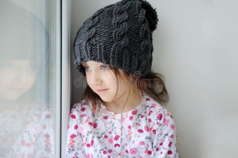 Adorable little girl in grey knit