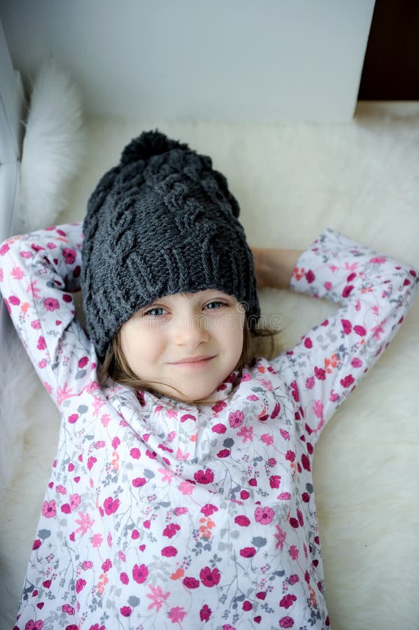 Adorable little girl in grey knit