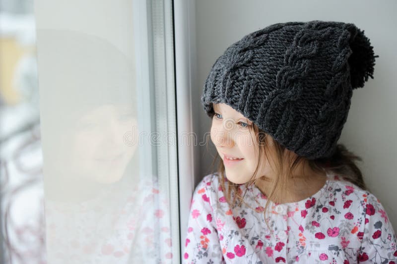 Adorable little girl in grey knit hat