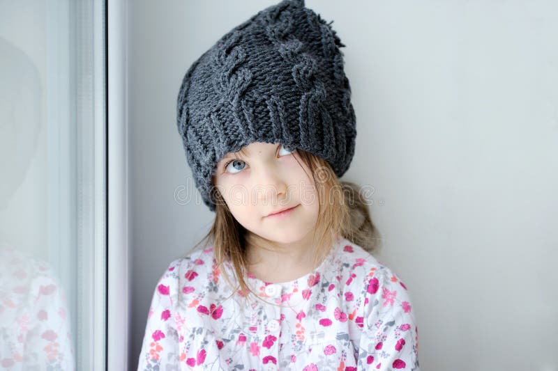 Adorable little girl in grey knit hat