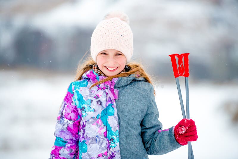 Adorable Little Girl Holding Ski Sticks in Hand Stock Photo - Image of ...