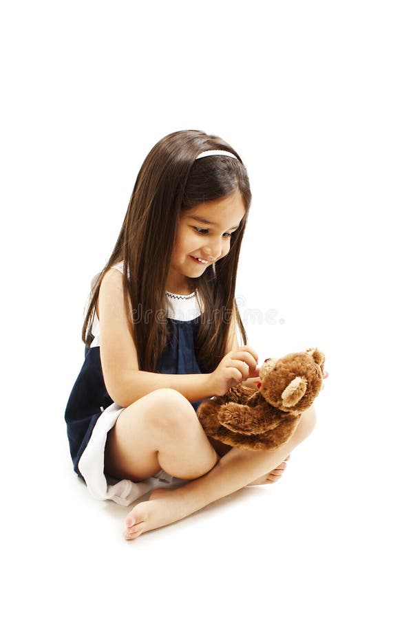 Adorable little girl play with doll