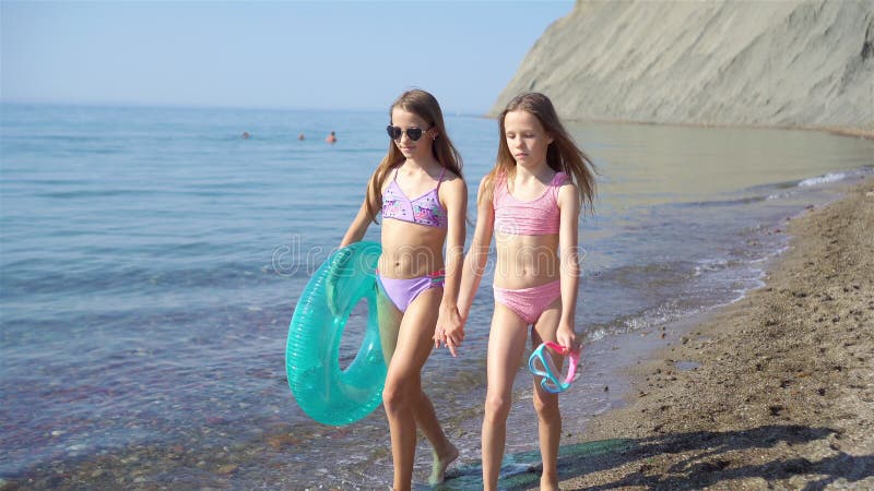 Adorable Little Girls Having Fun on the Beach Stock Footage - Video of  childhood, coastline: 195533326