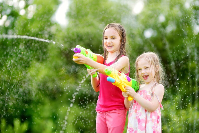 Adorable Little Girl Playing with Water Gun on Hot Summer Day. Cute Child  Having Fun with Water Outdoors Stock Photo - Image of leisure, beautiful:  97180460