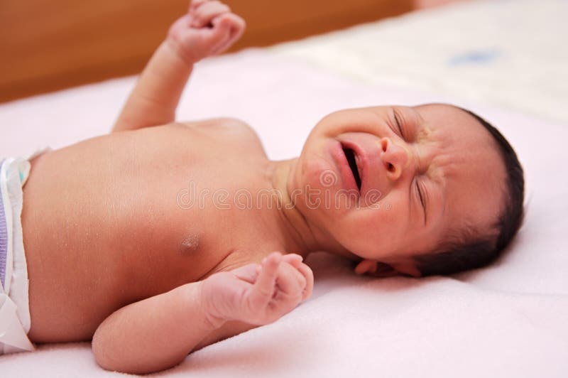 Adorable new born baby crying royalty free stock photo