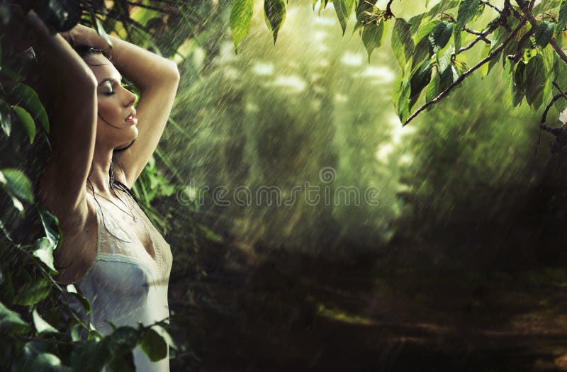 Adorable brunette in a rain forest royalty free stock images Adorable brunette in a rain forest royalty free stock images