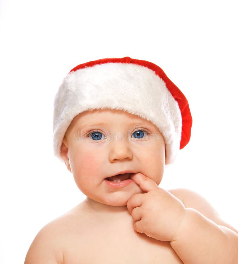 Adorable toddler in Christmas hat isolated on whit