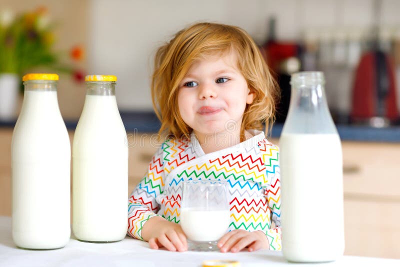 Young Toddler Drinking Milk Bottle Stock Photo 565476154
