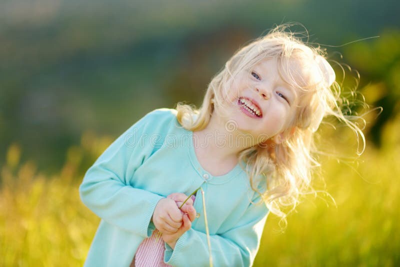 Adorable toddler girl on summer day