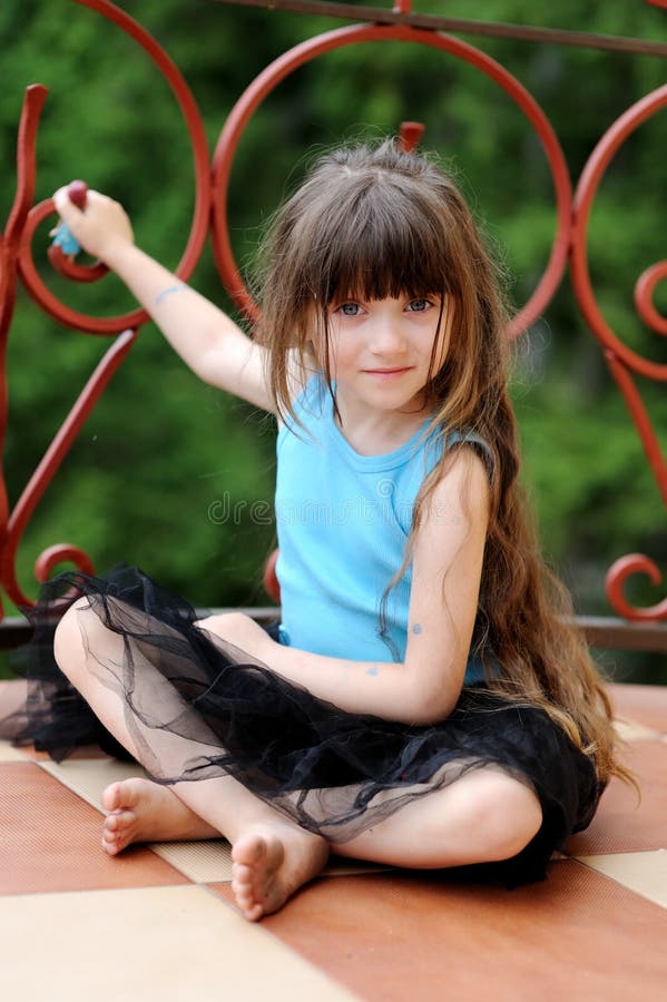 Adorable toddler girl with very long dark hair