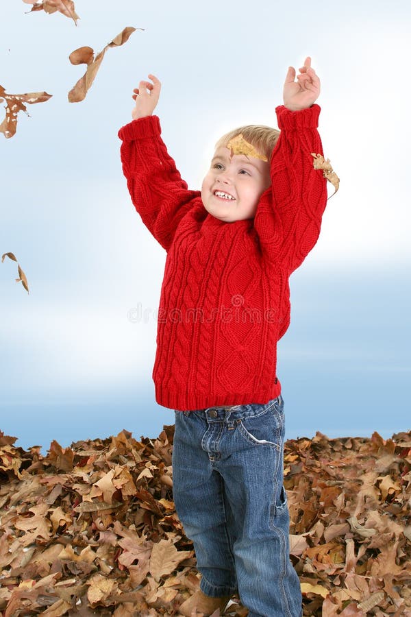 Adorable Two Year Old Playing In Leaves