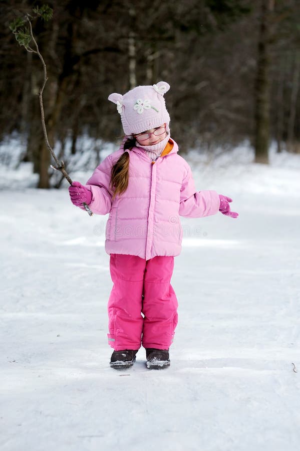 Adorable winter small girl in glasses