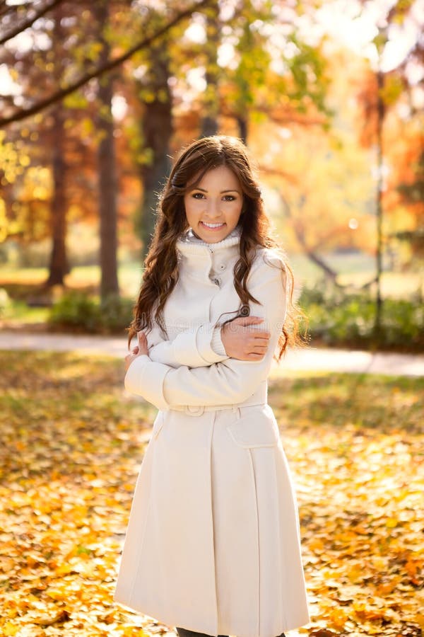 Adorable woman in autumn park