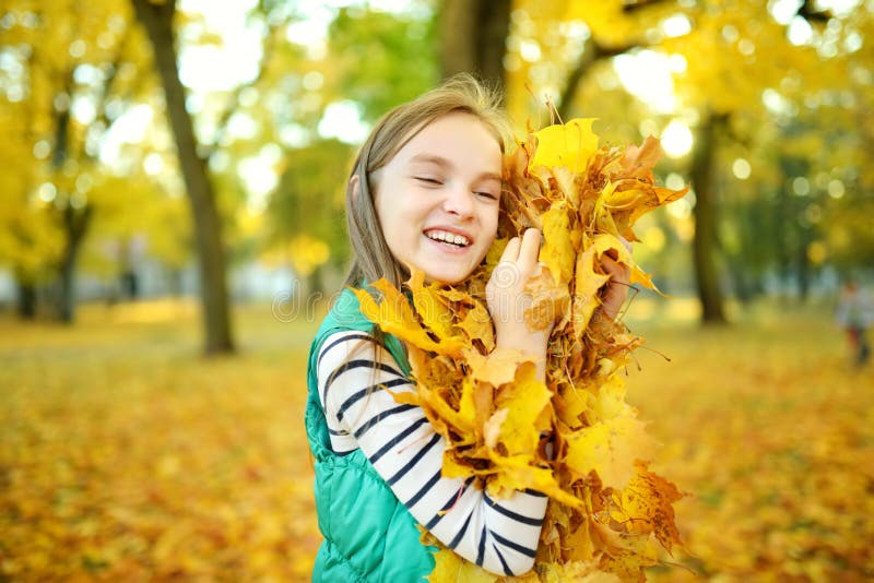 Adorable Young Girl Having Fun on Beautiful Autumn Day. Happy Child ...