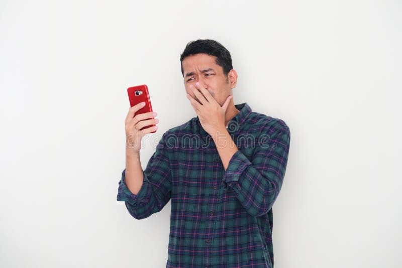 Sad Asian Man Has Bad Online Chat News And Feels Disappointed On The  Smartphone. Stock Photo, Picture and Royalty Free Image. Image 175416709.