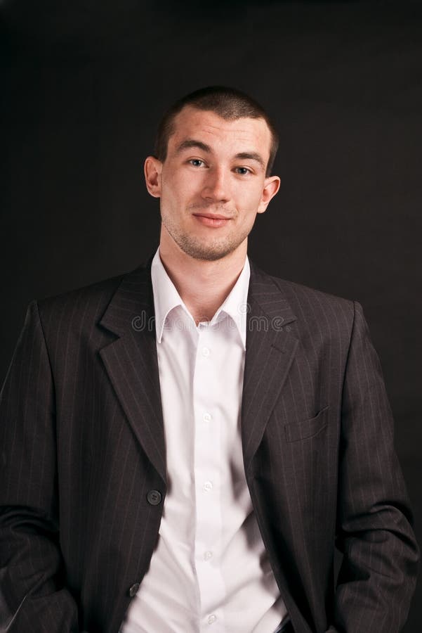 Adult businessman on a black background