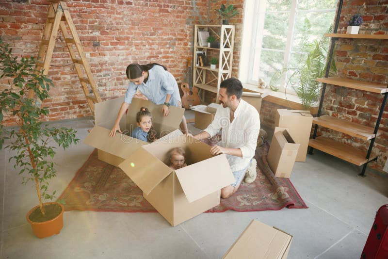 Adult family moved to a new house or apartment stock image Adult family moved to a new house or apartment stock image