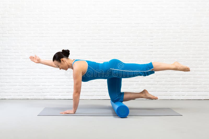 Adult Fit Woman Practice Pilates with Props in Fitness Studio Indoor, Bird  Dog Drill with One Leg Up and Foam Roller Stock Image - Image of activity,  caucasian: 215499443