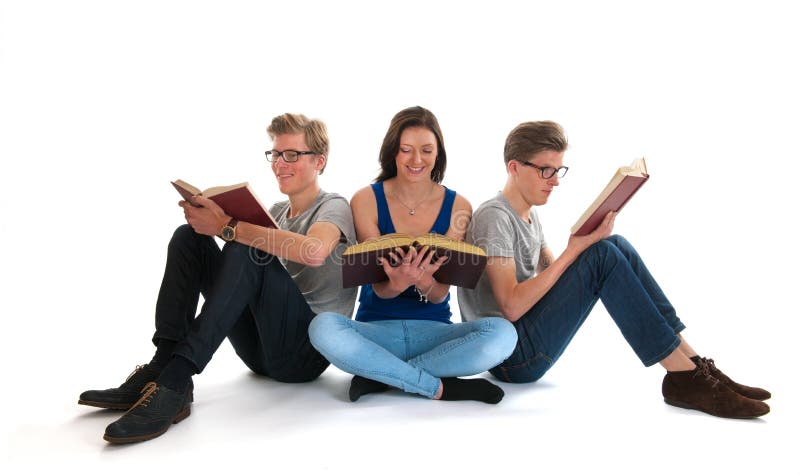 Adult male twins and young girl reading books stock photos