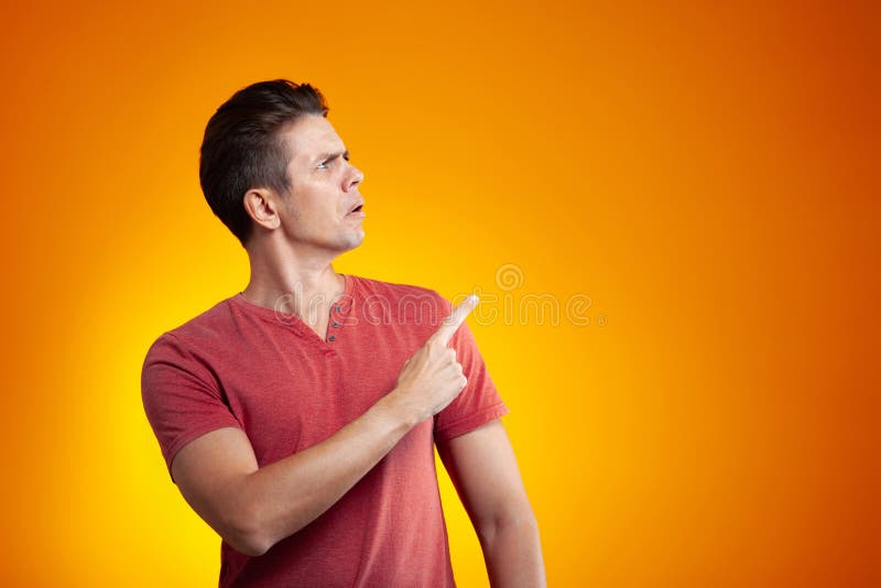Surprised Young Attractive Blonde Spreads Her Arms To Side Stock Image