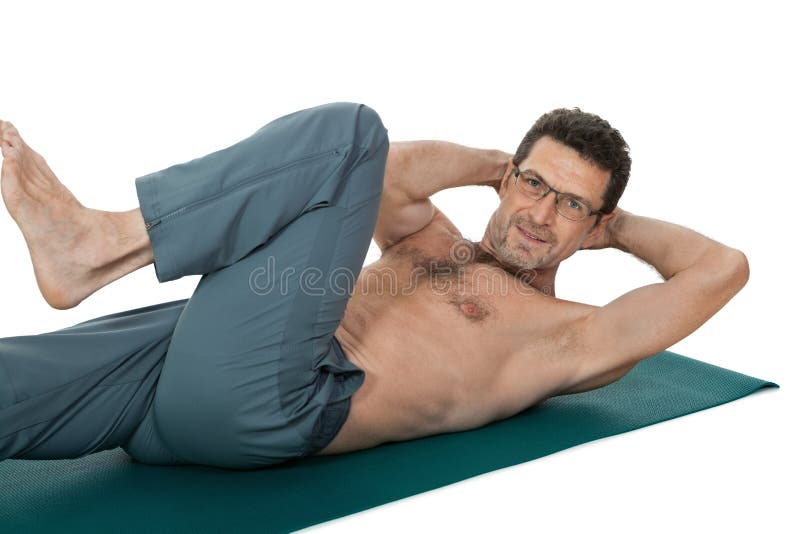 Adult smiling man doing workout sport fitness isolated on white stock image Adult smiling man doing workout sport fitness isolated on white stock image