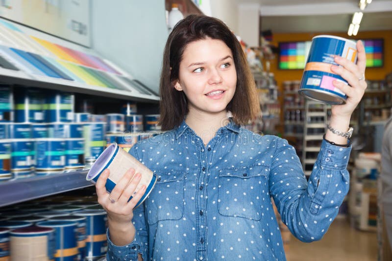 Adult woman choosing new wall paint