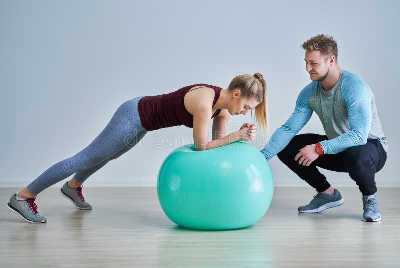 Woman with her personal fitness trainer royalty free stock photo Woman with her personal fitness trainer royalty free stock photo